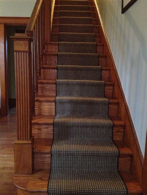 dark wood stairs with runner.